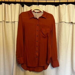 Free people size small rusty orange button up